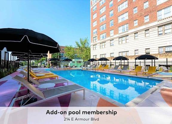 A pool with sun loungers and umbrellas is advertising add-on pool membership.