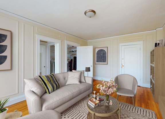 A living room with a couch, chair, and coffee table.