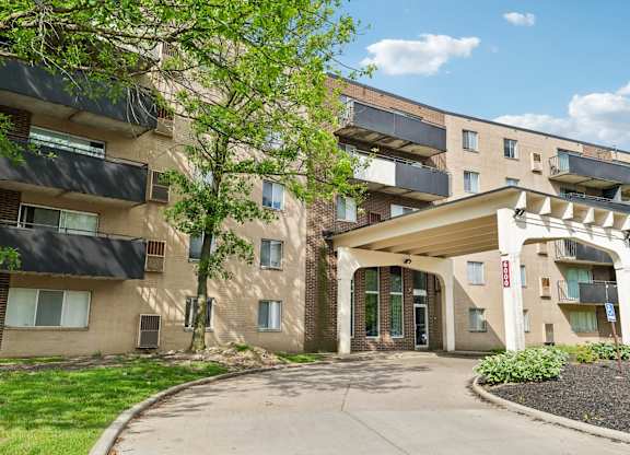 A building with a brown facade and a white entrance.
