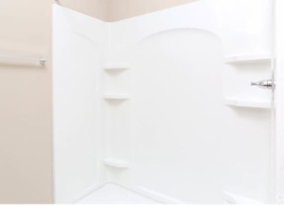 A white door with a silver handle and a silver lock.