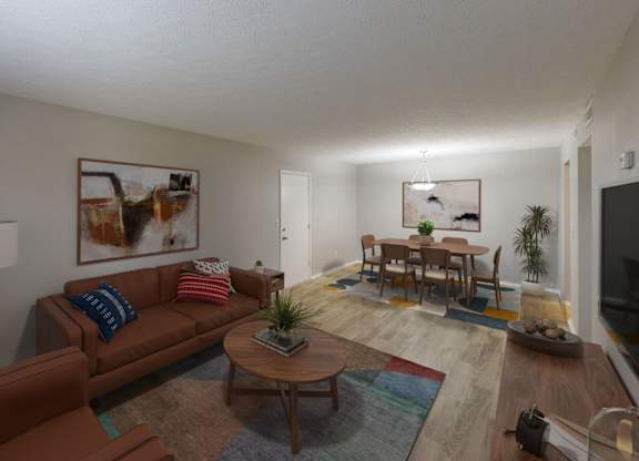 A living room with a brown couch and a coffee table.