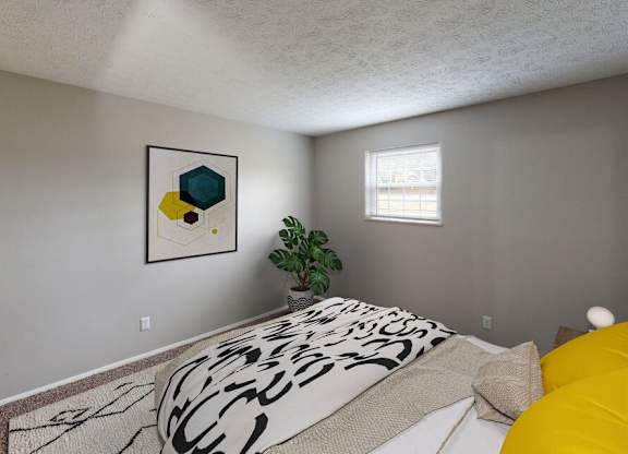 A bedroom with a bed, a plant, and a painting on the wall.