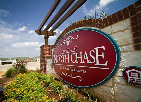 A sign for NorthChase bank with a red background and white lettering.