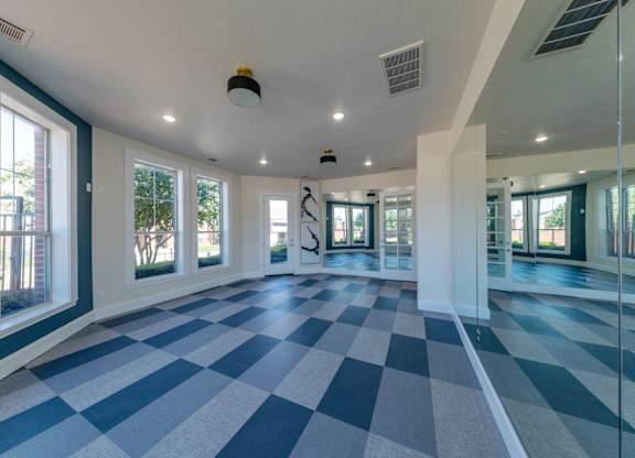 A large room with a checkered floor and white walls.