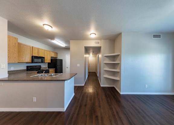 A kitchen with wooden cabinets and a countertop.