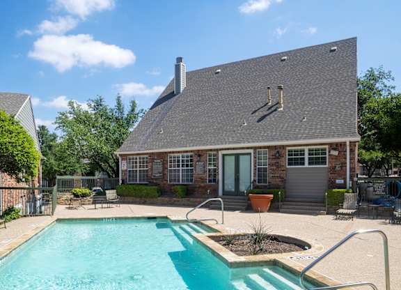A house with a pool in the backyard.