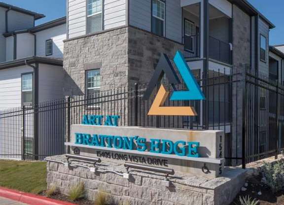 The image shows a building with a sign that reads "Arclay Brantons Hedge".