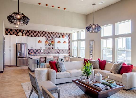 A modern living room with a large sofa and a coffee table.