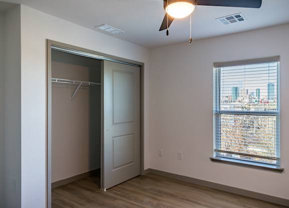 A room with a window and a door.