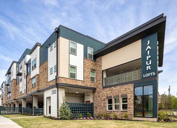 A modern apartment building named Jalapir Lofts is shown.