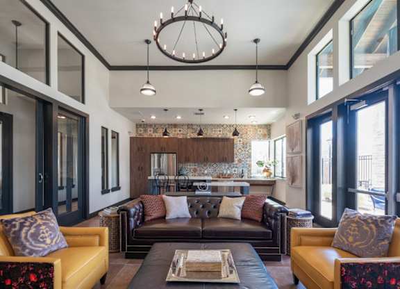 A modern living room with a large sectional sofa and a coffee table.