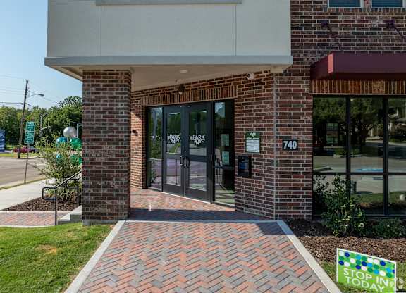 The front of a building with a sign that says Stop Today.