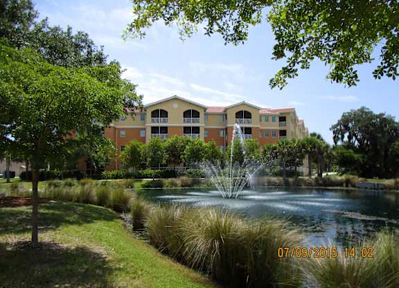 A building with a fountain in front of it.