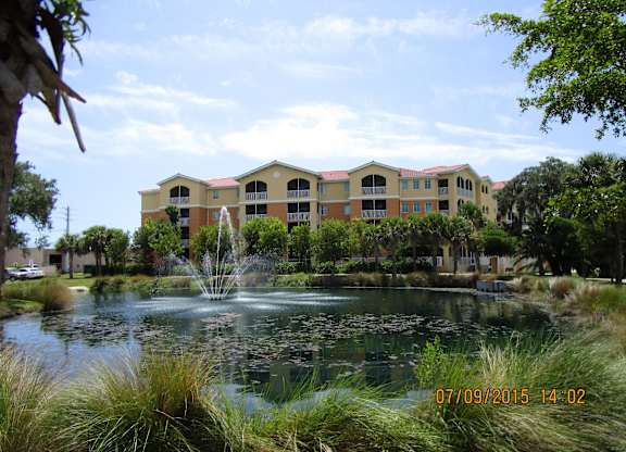 A building with a fountain in front of it.