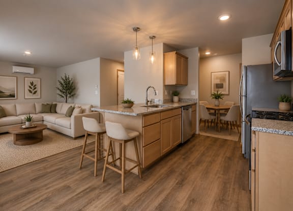 A modern kitchen with wooden floors and furniture.