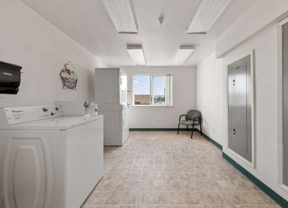 A laundry room with a washer and dryer.