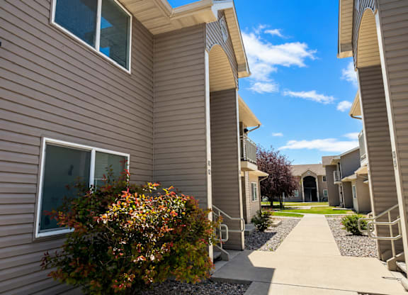 A row of houses with a clear blue sky above.