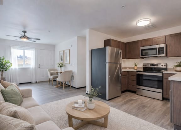 A modern kitchen with stainless steel appliances and wooden cabinets.