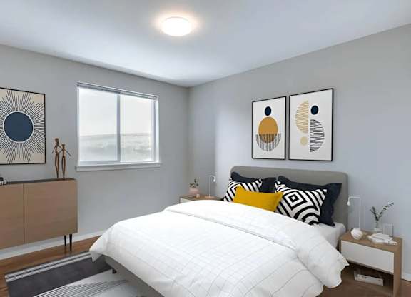 A bedroom with a large bed, a wooden dresser, and two framed artworks on the wall.