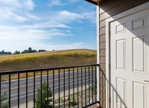 A white door is closed and has a black handle.