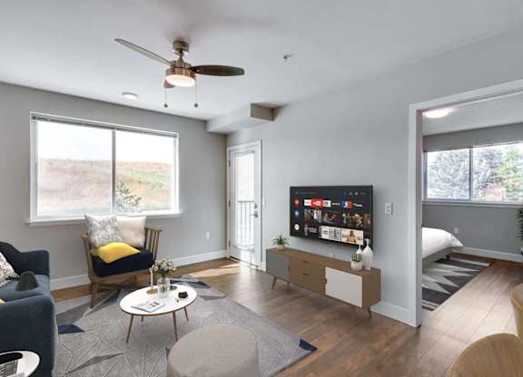 A living room with a television and a chair.