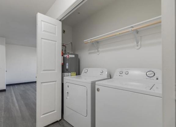 A laundry room with a washer and dryer.