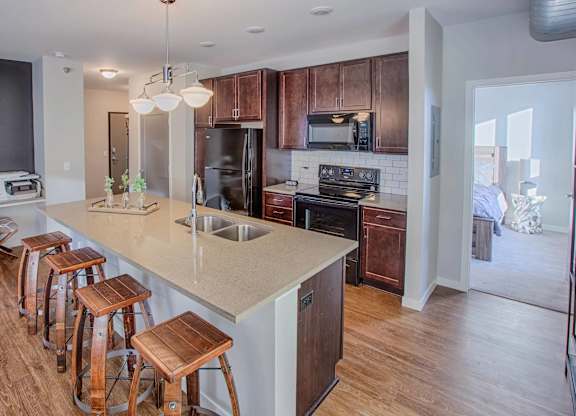 A kitchen with wooden cabinets and a white countertop.