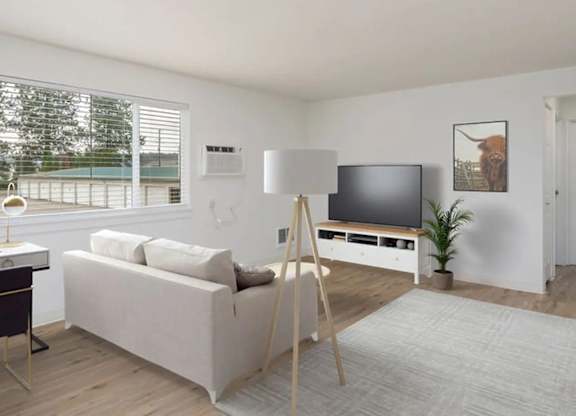 A modern living room with a white sofa, a wooden floor, and a large window.