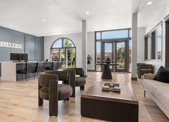 A living room with a sofa, armchairs and a coffee table.