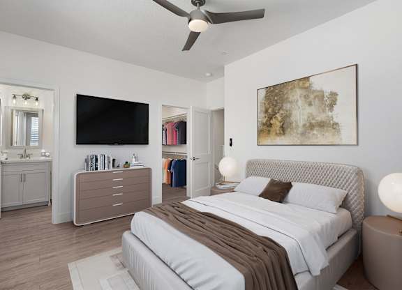 a bedroom with a bed and a ceiling fan