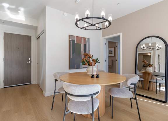 Image of a modern dining room with a round table and chairs in Hillcrest Ave located in Abbotsford, BC