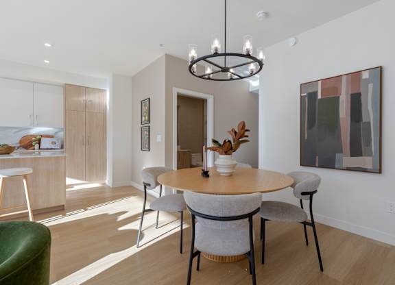 Image of a modern dining room with a round table and chairs in Hillcrest Ave located in Abbotsford, BC