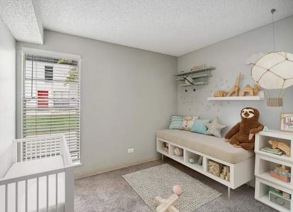 Baby's room with a crib at Villages at Gateway, Denver, CO