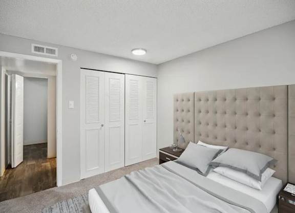 Bedroom with Large Bed at Villages at Gateway, Denver, CO