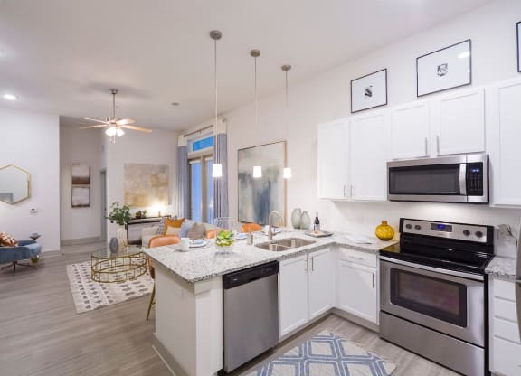 Open concept kitchen with granite countertops at Ciel Luxury Apartments, Jacksonville, FL