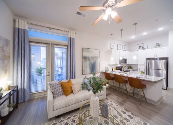 Open floor plan with kitchen island seating at Ciel Luxury Apartments, Jacksonville, Florida