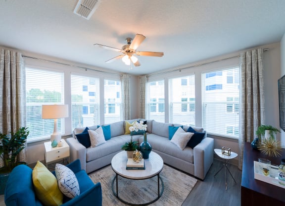 Bright living room with corner sectional sofa at Ciel Luxury Apartments, Jacksonville, 32246