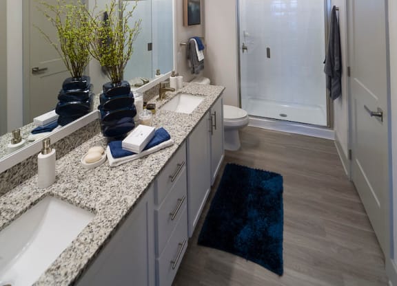 Spacious bathroom with dual vanity and walk in shower at Ciel Luxury Apartments, Jacksonville