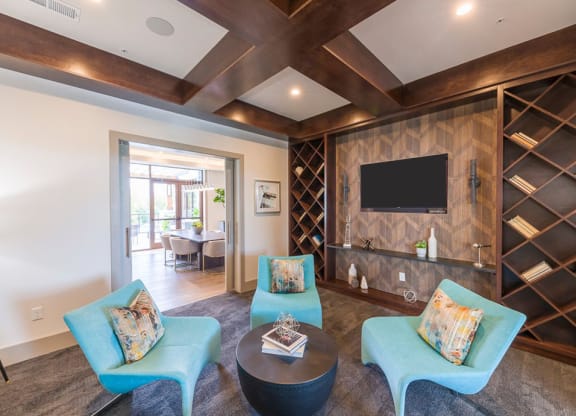 Modern living room with wood beam ceiling at Ciel Luxury Apartments, Jacksonville, 32246
