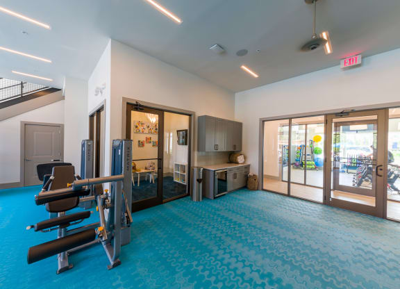 Fitness center with exercise machines and kitchenette at Ciel Luxury Apartments, Jacksonville, Florida