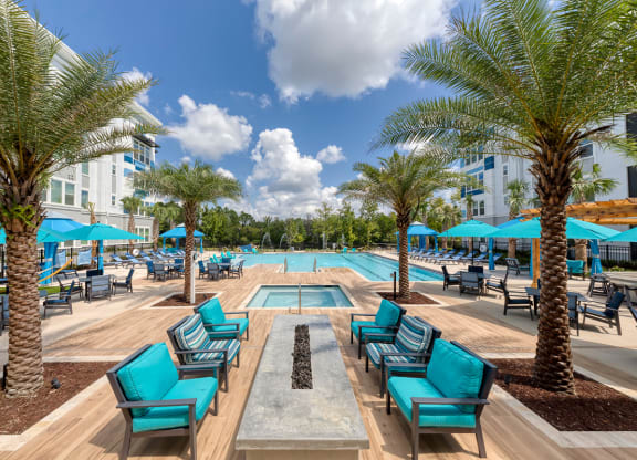 Pool deck with fire pit seating area at Ciel Luxury Apartments, Jacksonville, FL