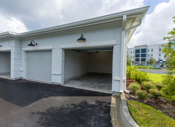 Detached garage units with open bay doors at Ciel Luxury Apartments, Jacksonville, FL 32246