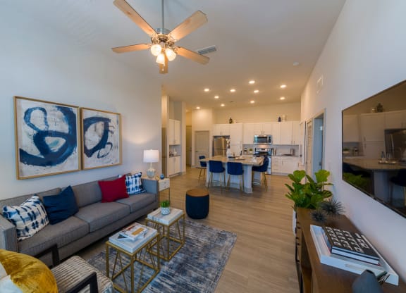 Open concept living room with blue accent artwork at Ciel Luxury Apartments, Jacksonville