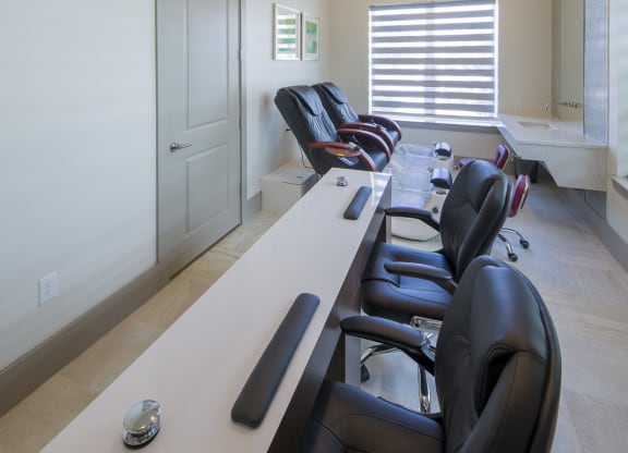 Nail salon with pedicure chairs and manicure stations at Ciel Luxury Apartments, Florida, 32246