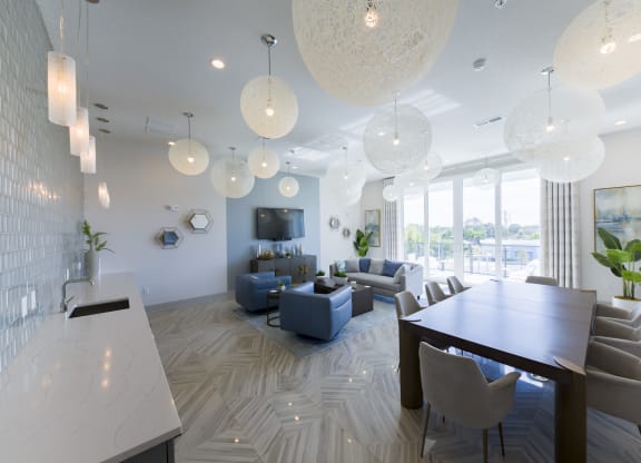 Modern open floor plan with spherical pendant lights at Ciel Luxury Apartments, Jacksonville, 32246
