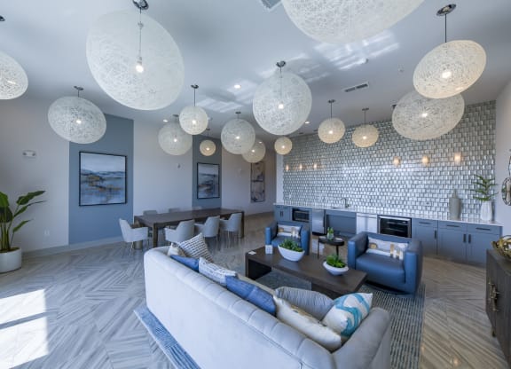 Community clubhouse with woven ceiling lights and blue accents at Ciel Luxury Apartments, Florida, 32246
