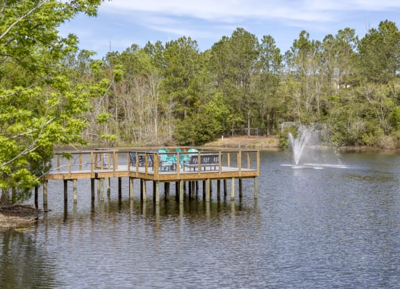 Wooden fishing dock with fountain and seating at Ciel Luxury Apartments, Jacksonville, 32246