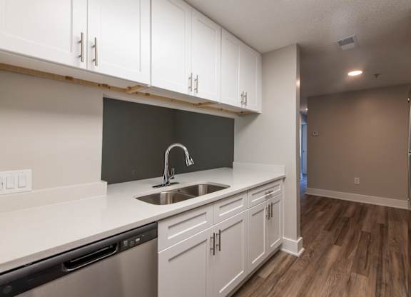 Dobbins Hill kitchen with white cabinets and a stainless steel refrigerator.