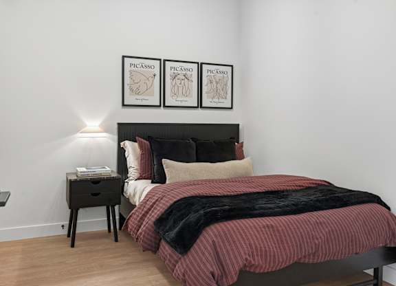 Bedroom with Cozy Bed and Nightstand at Richmond Square, Ontario