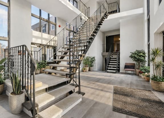 A modern house with a staircase and plants.